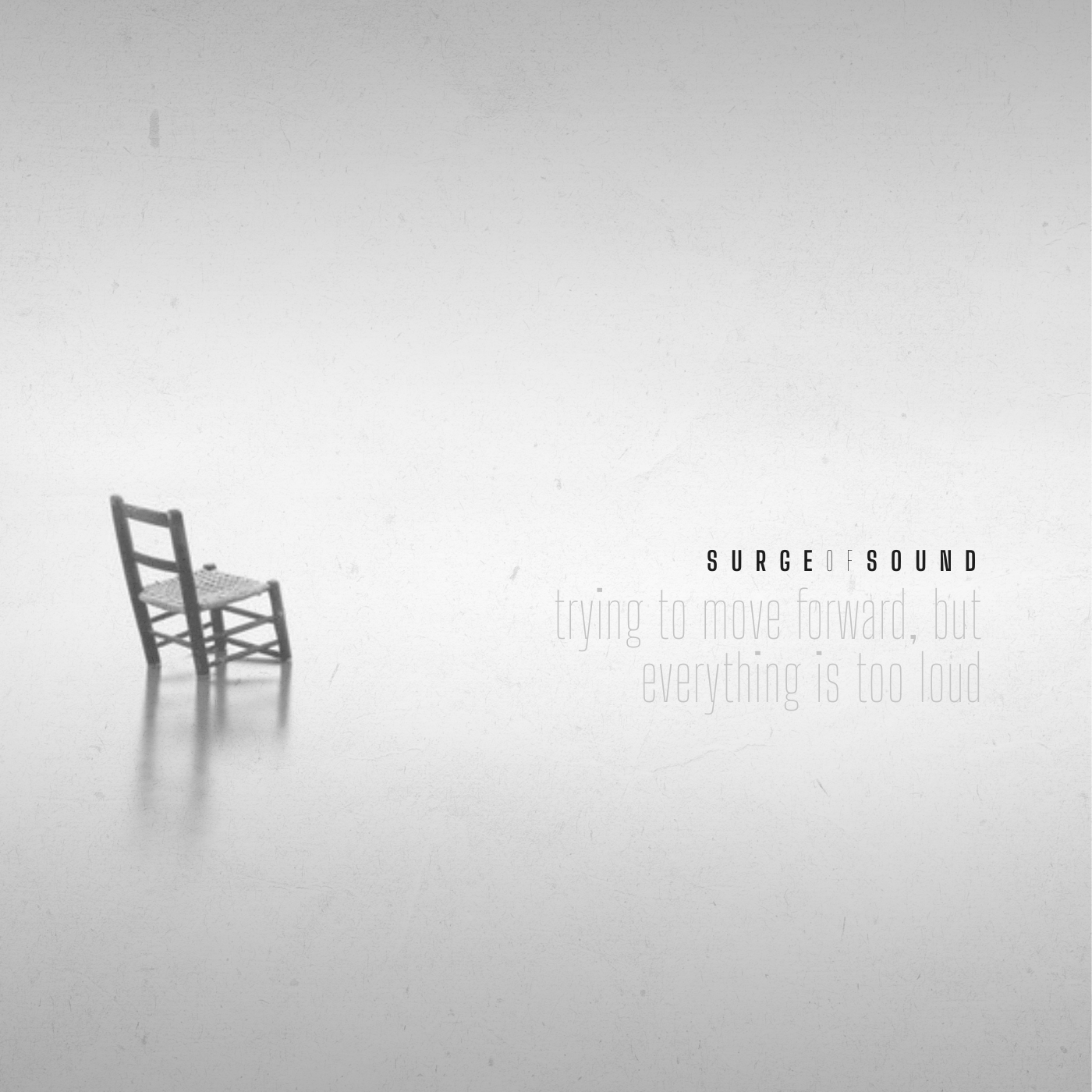 An empty chair surrounded by heavy negative space.